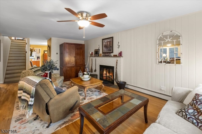 53 Pequot Road Ringwood, NJ 07456 - Photo 8 of 35 a living room with furniture and a fireplace