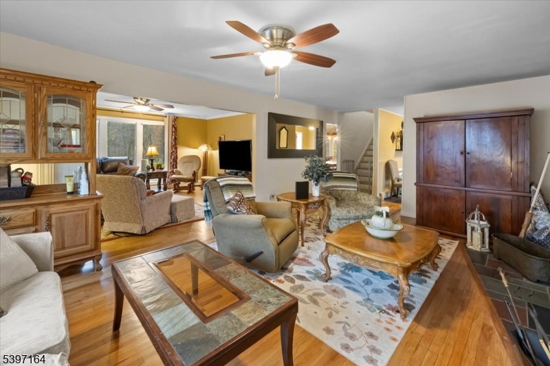 53 Pequot Road Ringwood, NJ 07456 - Photo 10 of 35 a living room with furniture and a flat screen tv