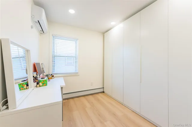 a view of an entryway with wooden floor