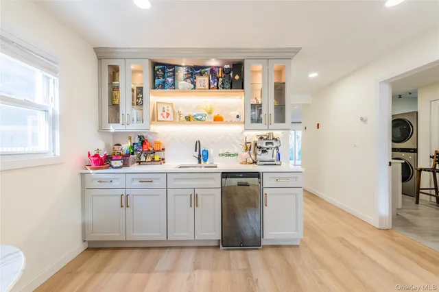 a kitchen with granite countertop white cabinets and white appliances