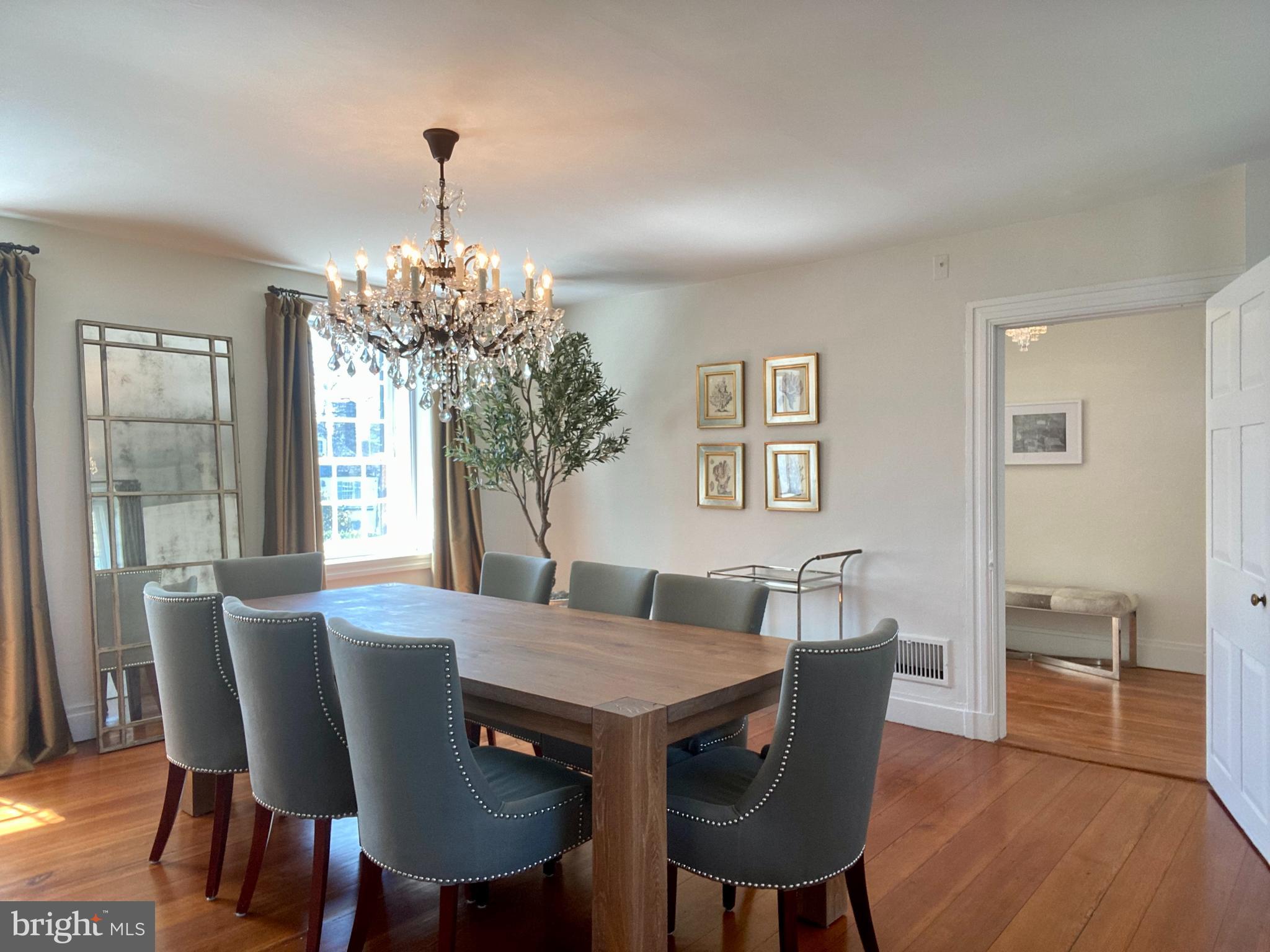 121 Upnor Road Baltimore, MD 21212 - Photo 20 of 79 a view of a dining room with furniture window and wooden floor