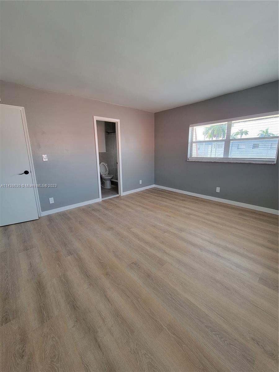 5321 Northwest 27th Street, Unit A4 Lauderhill, FL 33313 - Photo 13 of 19 a view of an empty room with window and closet