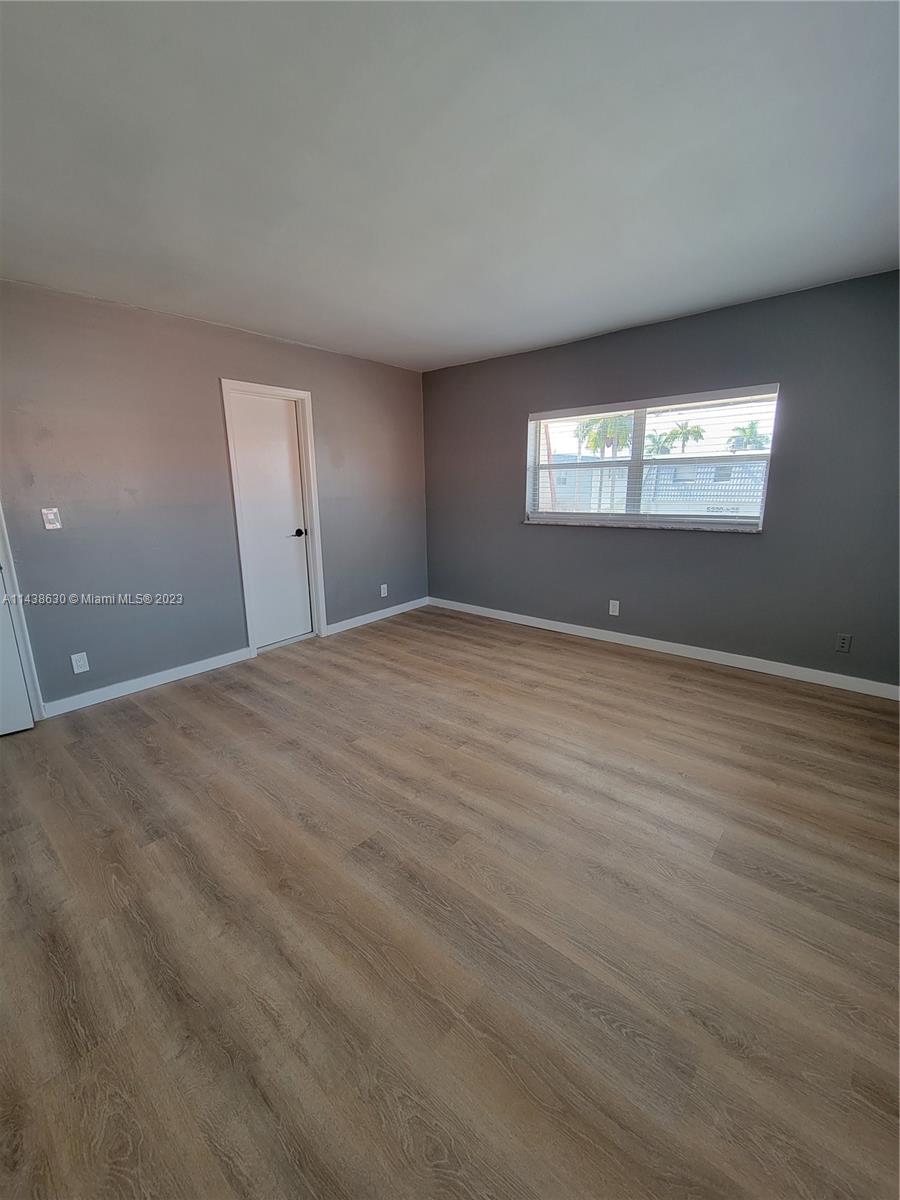 5321 Northwest 27th Street, Unit A4 Lauderhill, FL 33313 - Photo 15 of 19 a view of an empty room with window and stairs