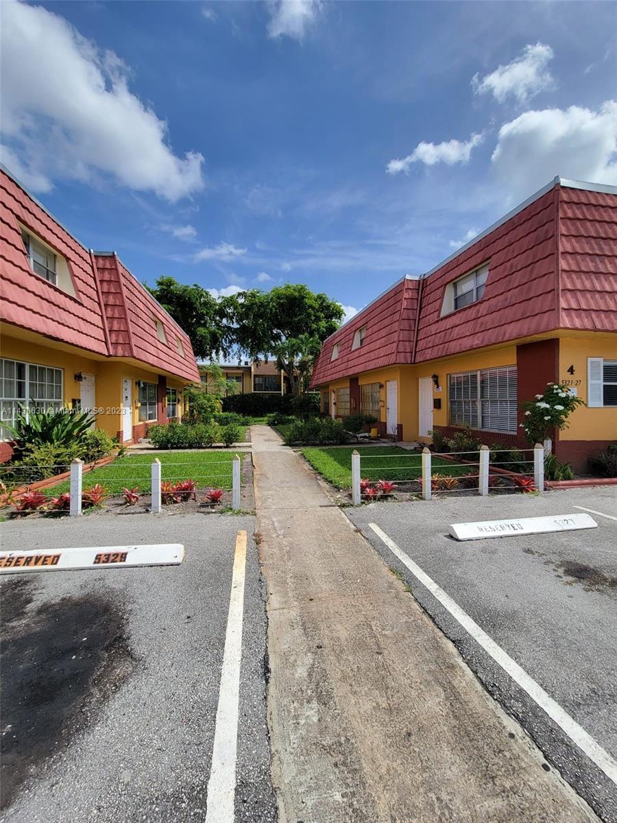 5321 Northwest 27th Street, Unit A4 Lauderhill, FL 33313 - Photo 16 of 19 a front view of a building with street