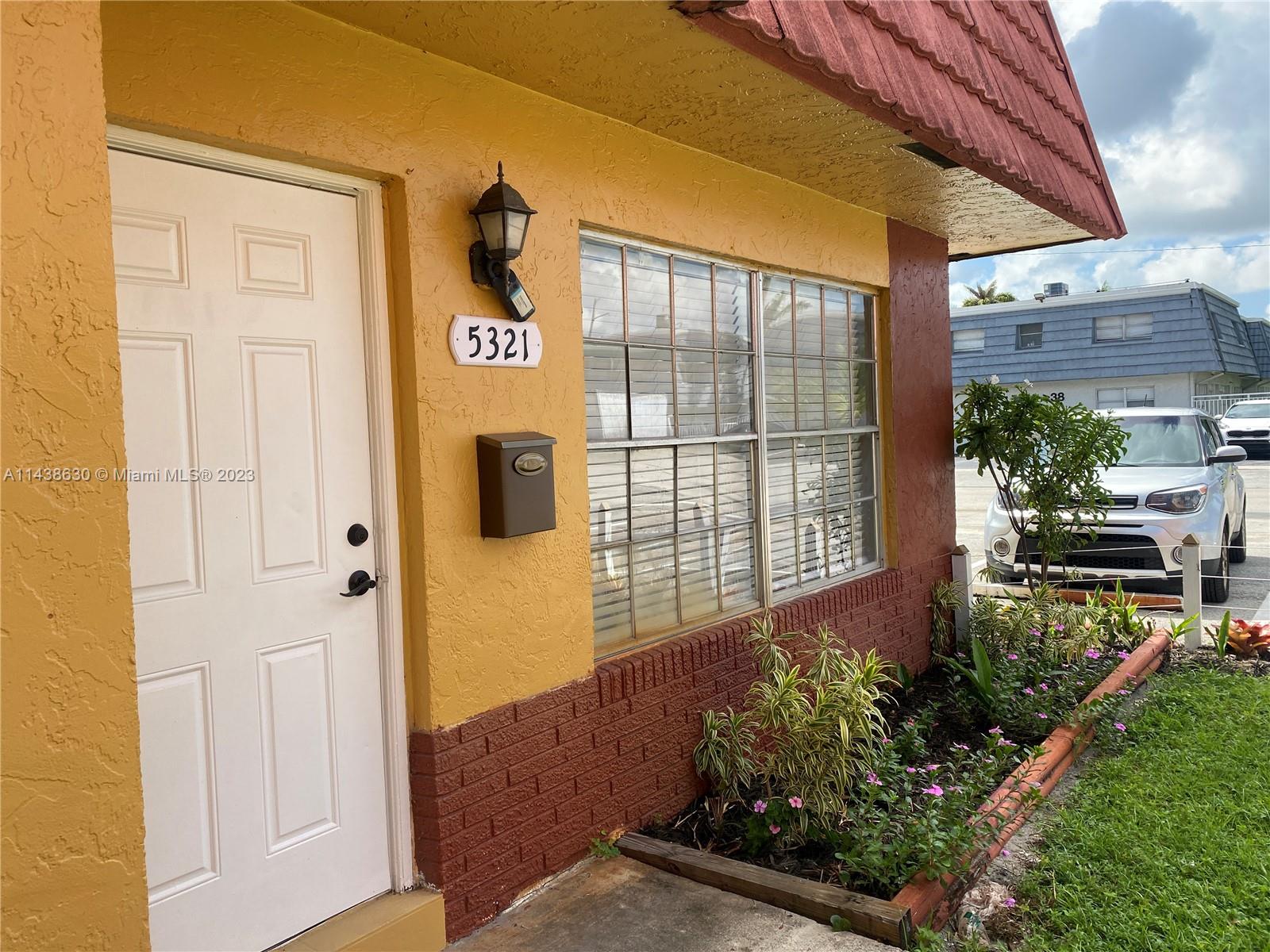 5321 Northwest 27th Street, Unit A4 Lauderhill, FL 33313 - Photo 2 of 19 a view of house and front door