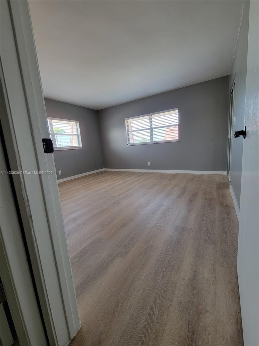 5321 Northwest 27th Street, Unit A4 Lauderhill, FL 33313 - Photo 7 of 19 a view of an empty room and window