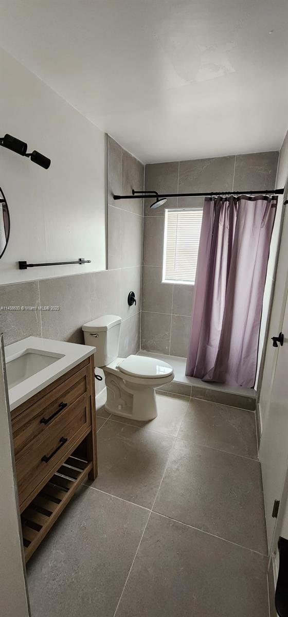 5321 Northwest 27th Street, Unit A4 Lauderhill, FL 33313 - Photo 8 of 19 a bathroom with a sink a toilet and bathtub