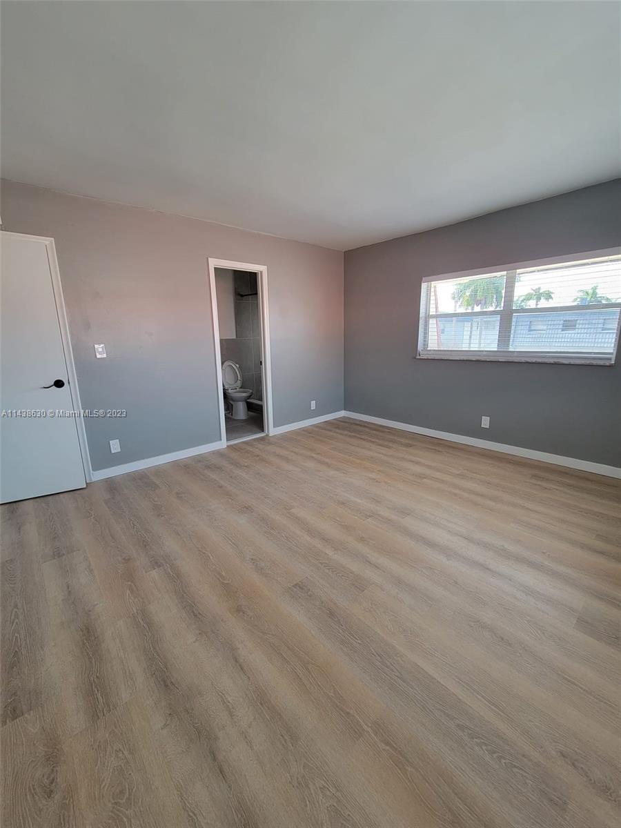 5321 Northwest 27th Street, Unit A4 Lauderhill, FL 33313 - Photo 10 of 19 a view of an empty room with window and closet