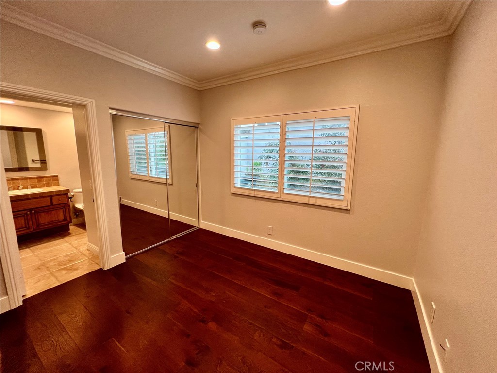 15 Larkfield Lane Laguna Niguel, CA 92677 - Photo 17 of 55 an empty room with wooden floor and windows