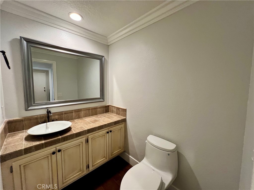 15 Larkfield Lane Laguna Niguel, CA 92677 - Photo 18 of 55 a bathroom with a toilet sink and mirror