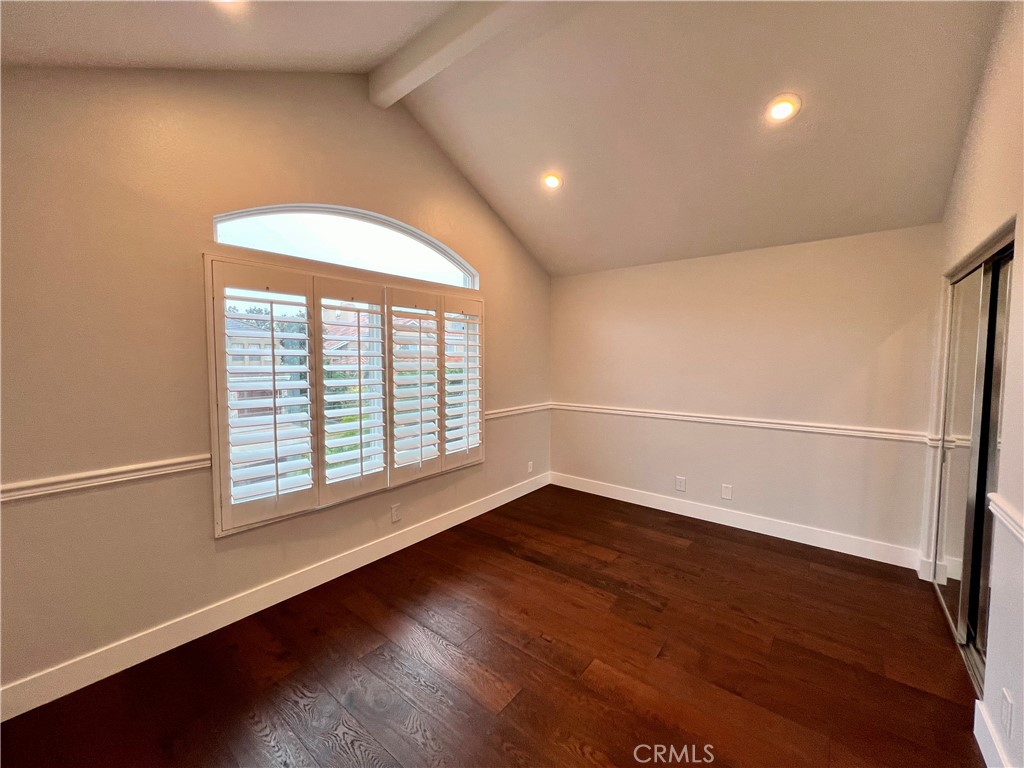 15 Larkfield Lane Laguna Niguel, CA 92677 - Photo 26 of 55 an empty room with wooden floor and windows