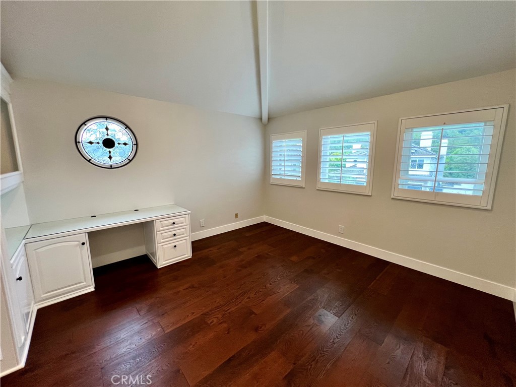 15 Larkfield Lane Laguna Niguel, CA 92677 - Photo 29 of 55 an empty room with wooden floor and windows