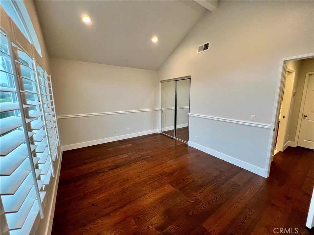 15 Larkfield Lane Laguna Niguel, CA 92677 - Photo 30 of 55 an empty room with wooden floor and entrance