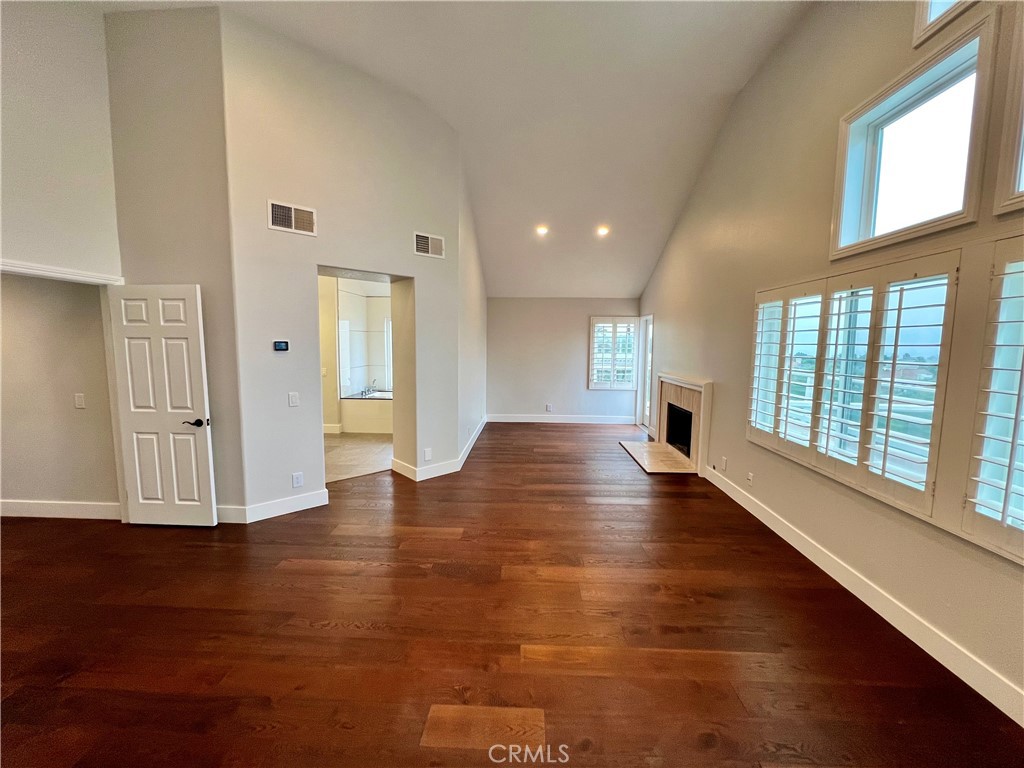 15 Larkfield Lane Laguna Niguel, CA 92677 - Photo 34 of 55 a view of an empty room with wooden floor and a window