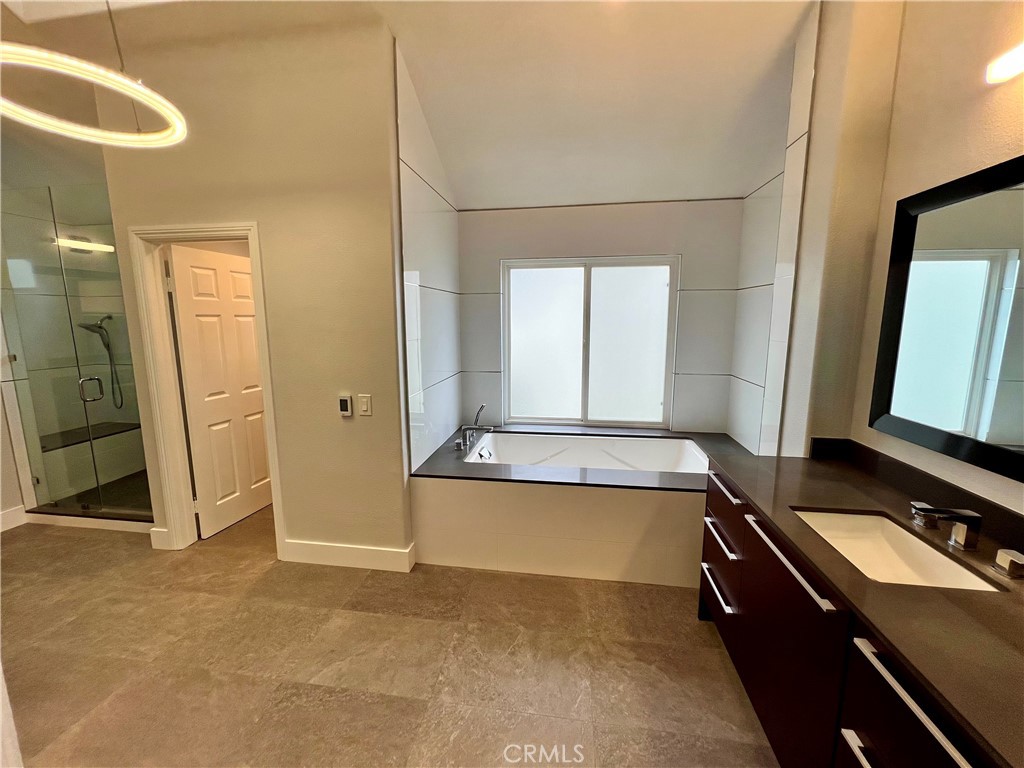 15 Larkfield Lane Laguna Niguel, CA 92677 - Photo 42 of 55 a bathroom with a granite countertop sink and a mirror