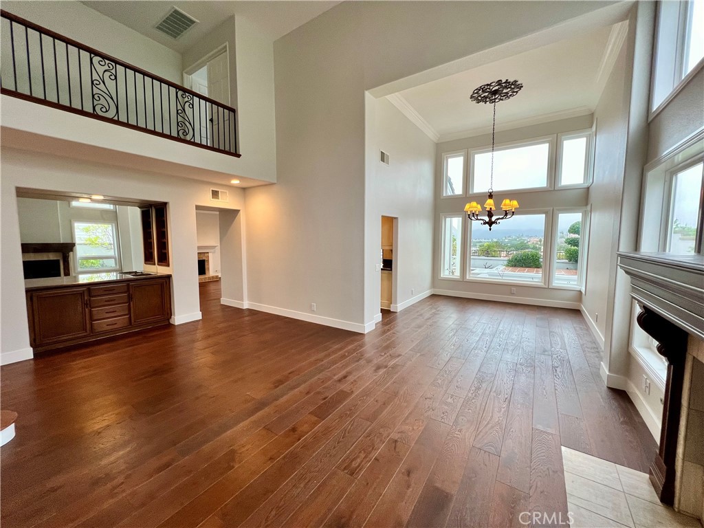15 Larkfield Lane Laguna Niguel, CA 92677 - Photo 5 of 55 a view of a hallway view with wooden floor and a kitchen