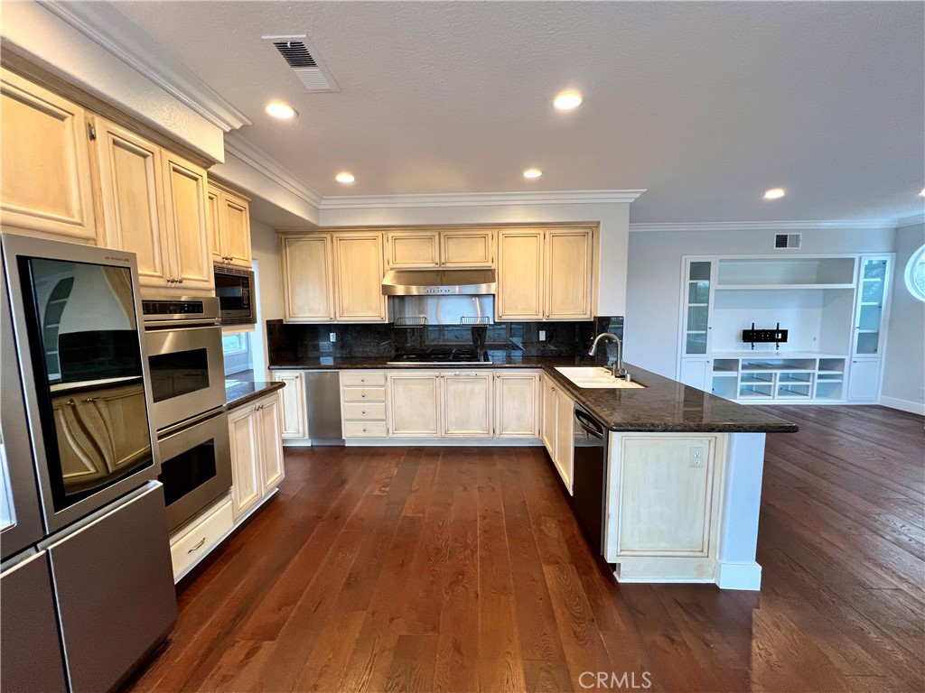 15 Larkfield Lane Laguna Niguel, CA 92677 - Photo 9 of 55 a large kitchen with stainless steel appliances and a large window