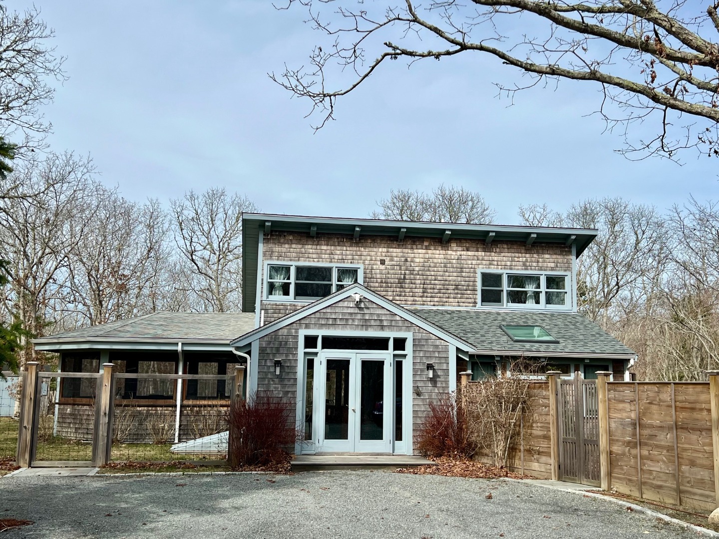 50 Bradley Martin Road West Tisbury, MA 02568 - Photo 1 of 37 a front view of a house with a garden and yard