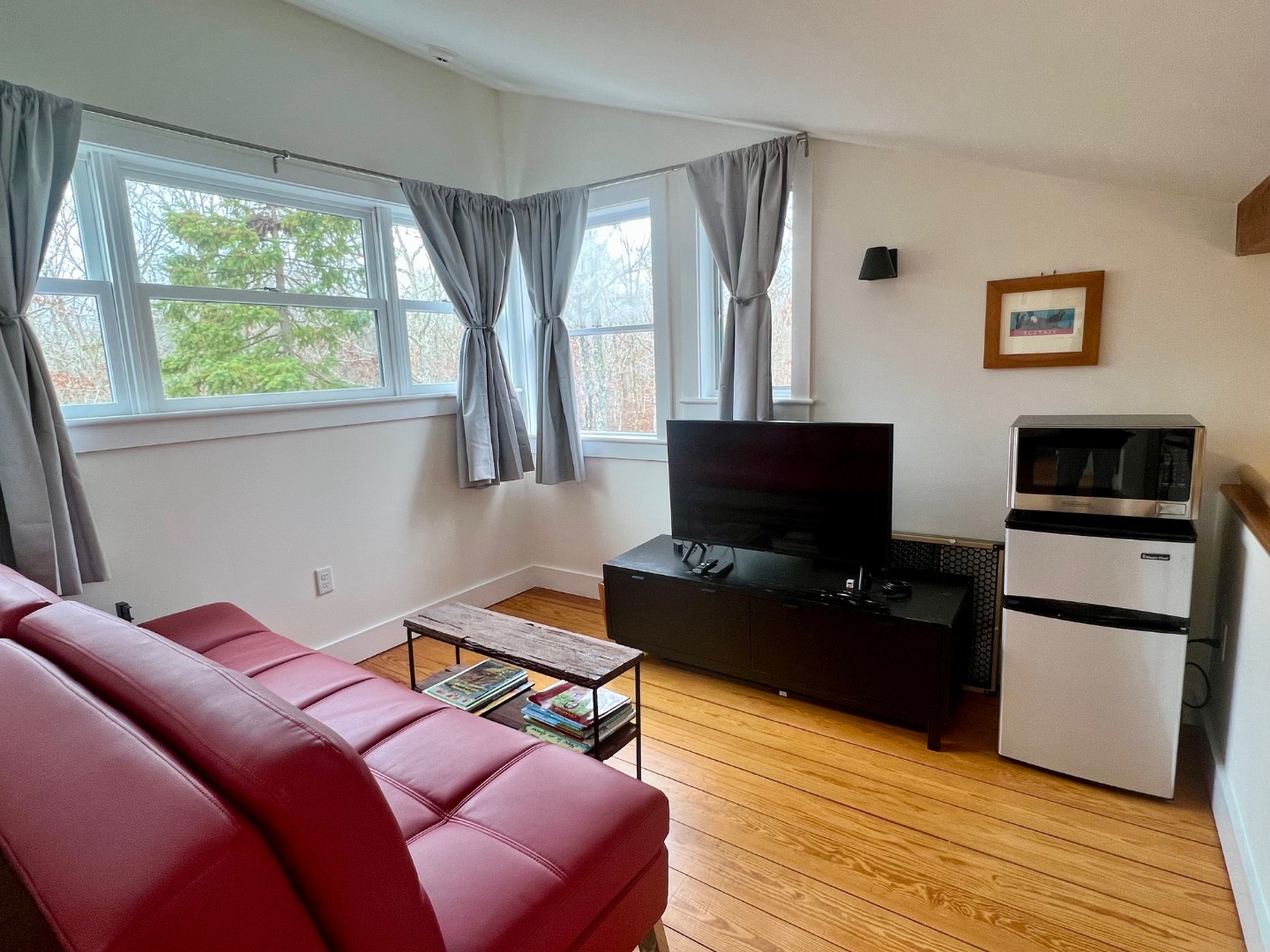 50 Bradley Martin Road West Tisbury, MA 02568 - Photo 19 of 37 a bedroom with furniture and a flat screen tv