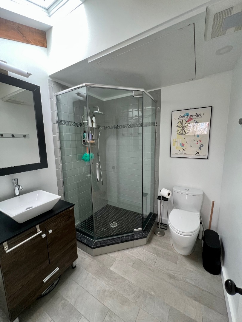 50 Bradley Martin Road West Tisbury, MA 02568 - Photo 20 of 37 a bathroom with a double vanity sink toilet and shower