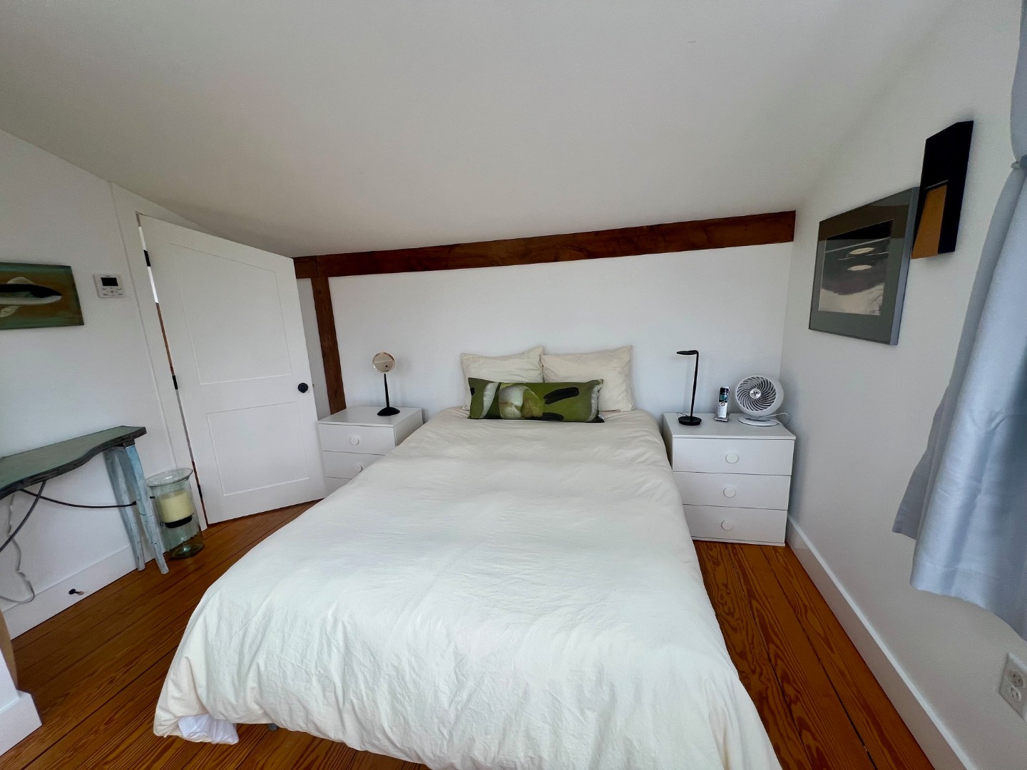 50 Bradley Martin Road West Tisbury, MA 02568 - Photo 22 of 37 a bedroom with a bed and wooden floor