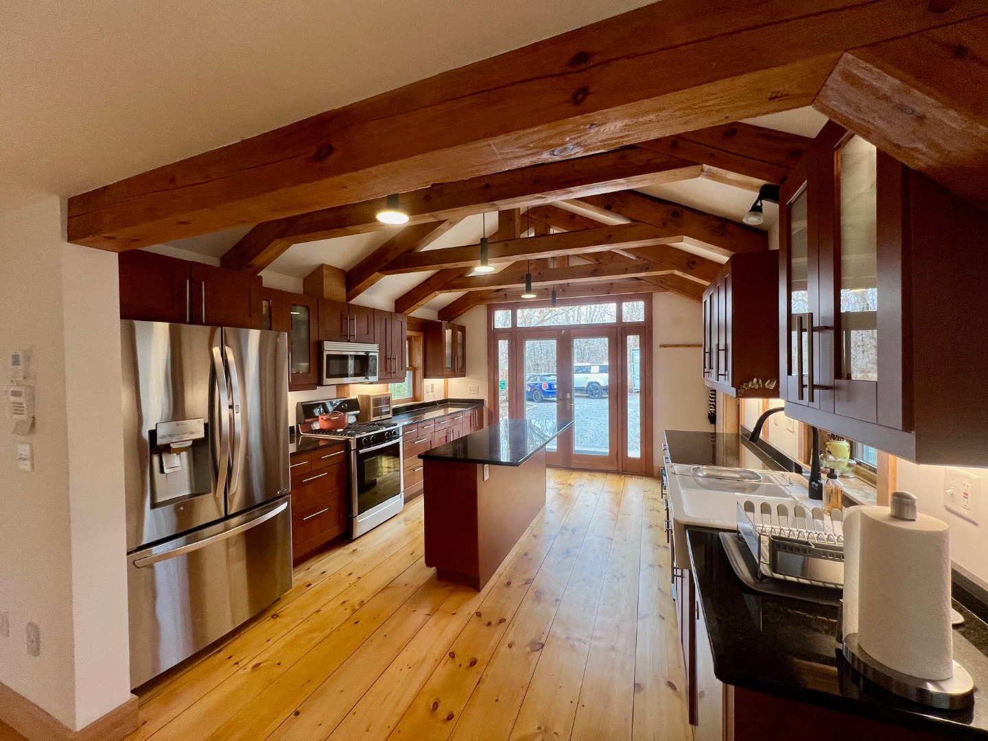 50 Bradley Martin Road West Tisbury, MA 02568 - Photo 3 of 37 a open kitchen with stainless steel appliances granite countertop a stove and a refrigerator