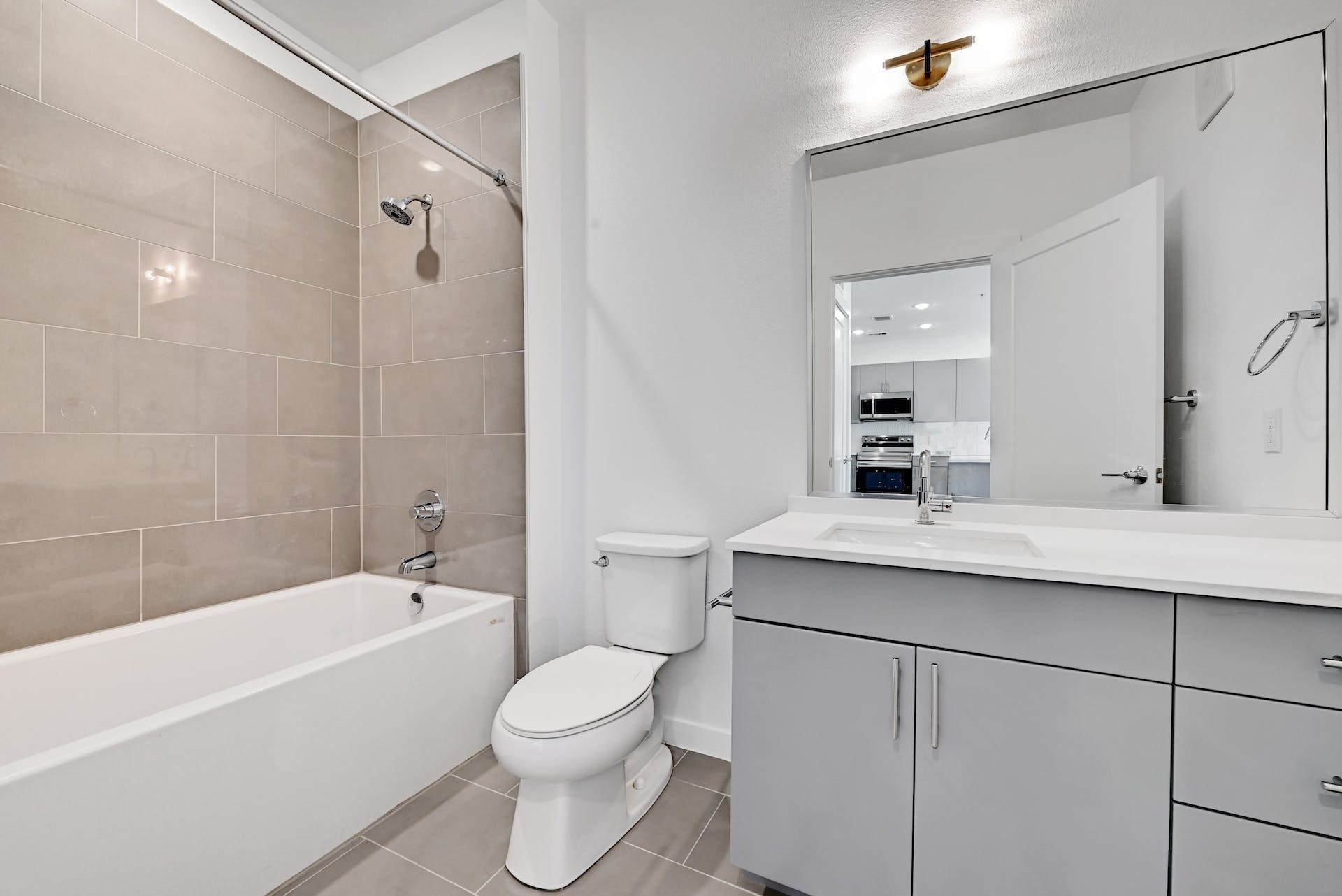 4801 Springdale Road, Unit 1301 Austin, TX 78723 - Photo 22 of 39 A well-appointed bathroom with a vanity and a shower-over-tub, offering modern convenience.