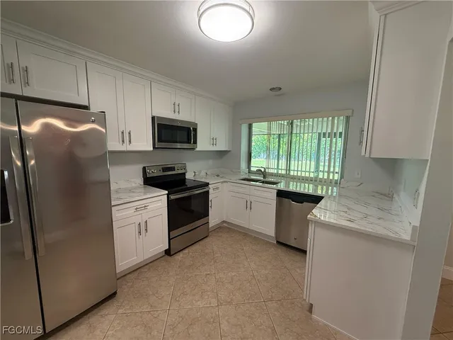a view of a backyard with plants and a garden