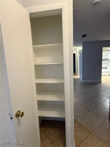 a view of a hallway with closet