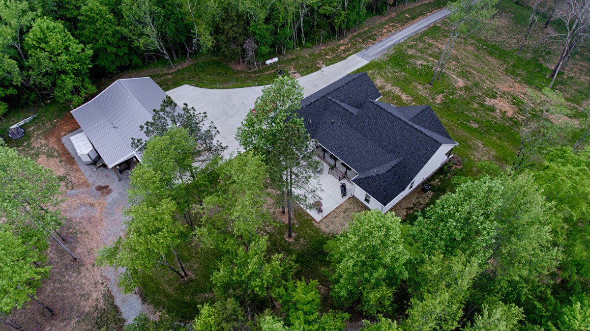 146 Philpot Road Ardmore, TN 38449 - Photo 54 of 54 an aerial view of a house with garden space and a street view