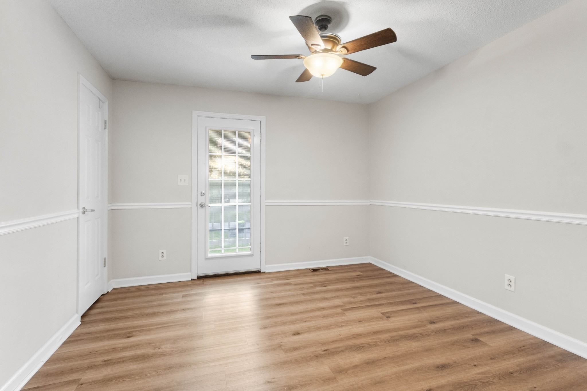 511 Sango Road Clarksville, TN 37043 - Photo 17 of 22 an empty room with wooden floor and windows