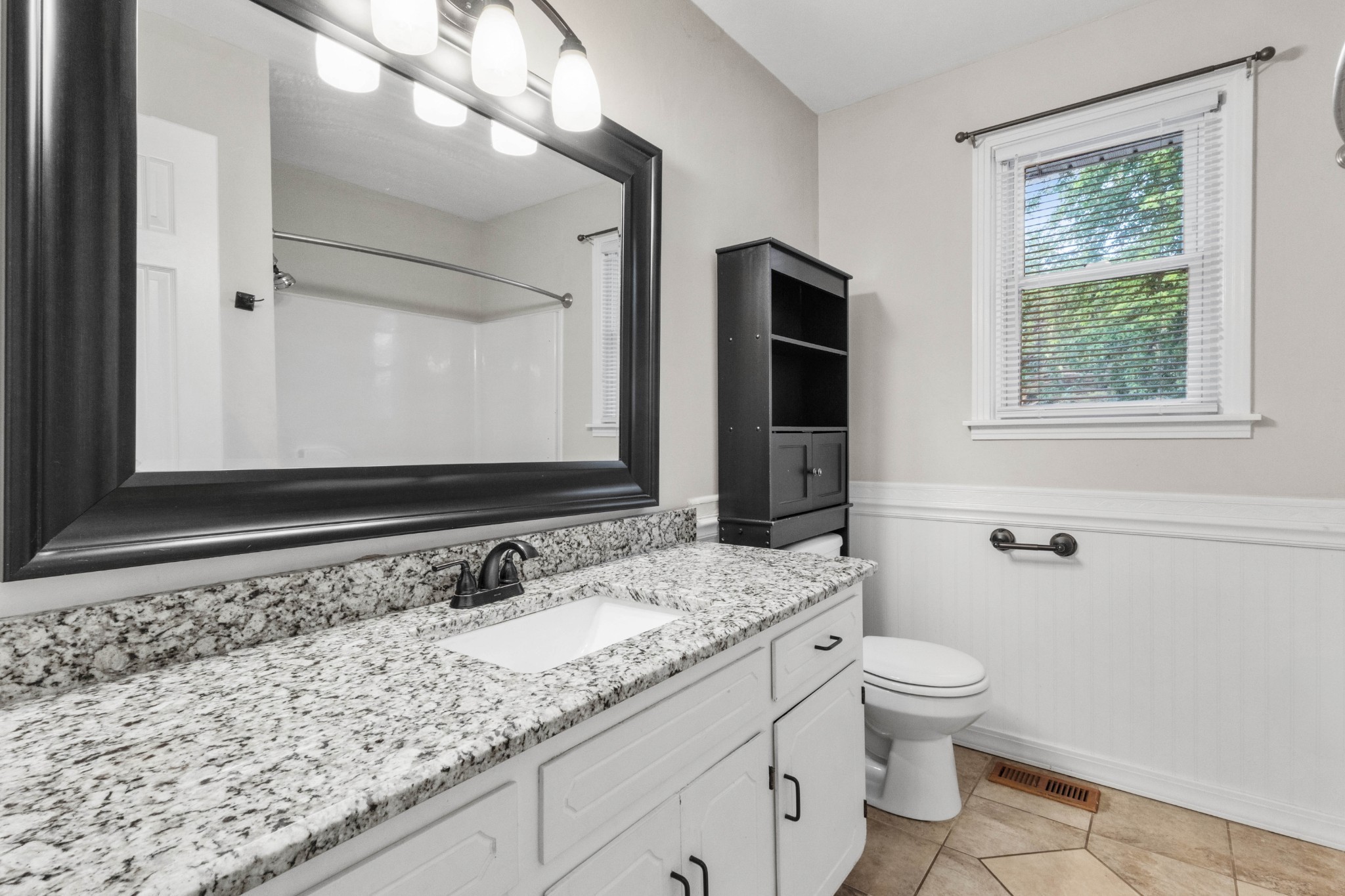 511 Sango Road Clarksville, TN 37043 - Photo 19 of 22 a bathroom with a granite countertop sink and a mirror