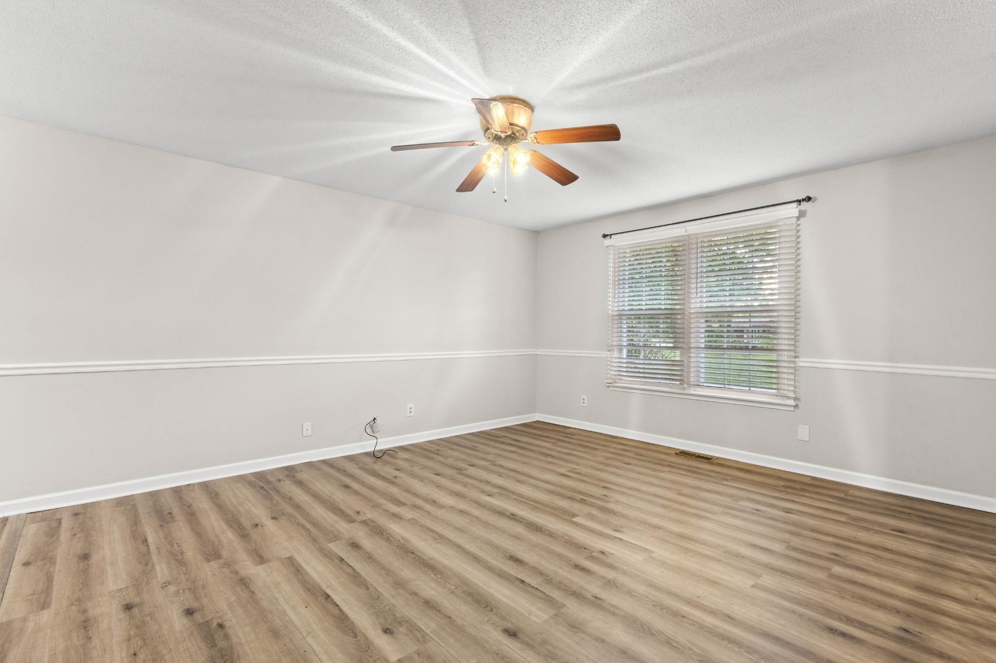 511 Sango Road Clarksville, TN 37043 - Photo 8 of 22 wooden floor in an empty room with a window