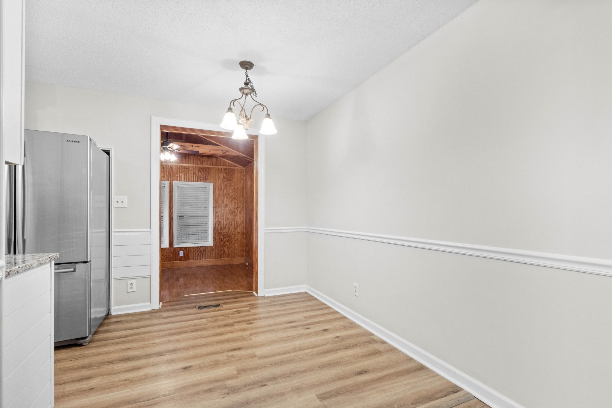 511 Sango Road Clarksville, TN 37043 - Photo 10 of 22 a view of a hallway with wooden floor and a bathroom