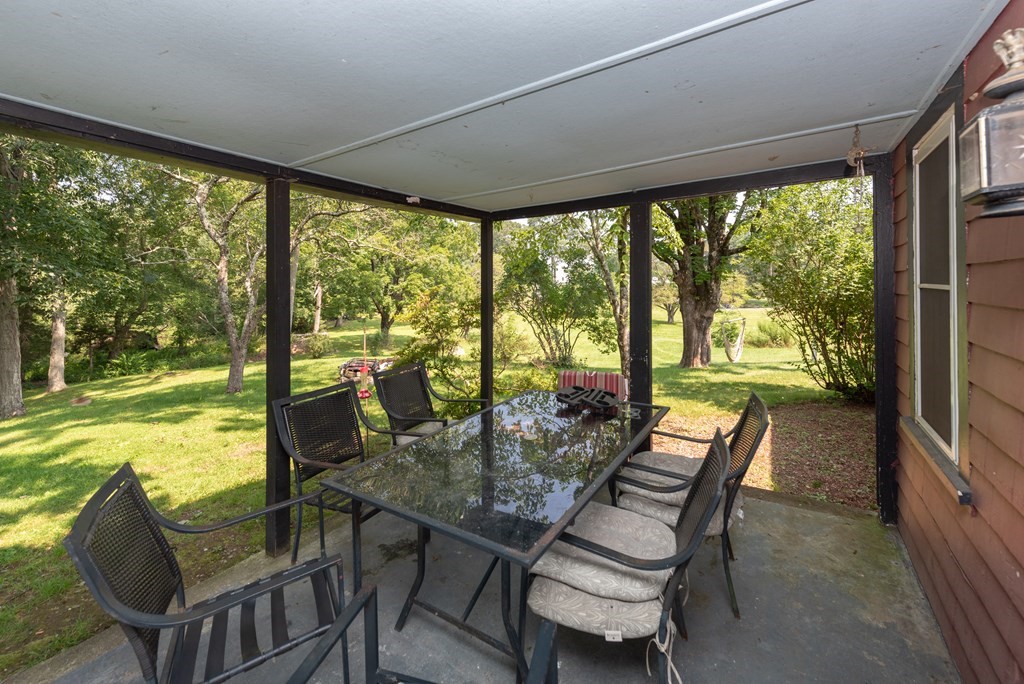 90 Anawan Street Rehoboth, MA 02769 - Photo 12 of 24 a outdoor dining space with furniture and garden view
