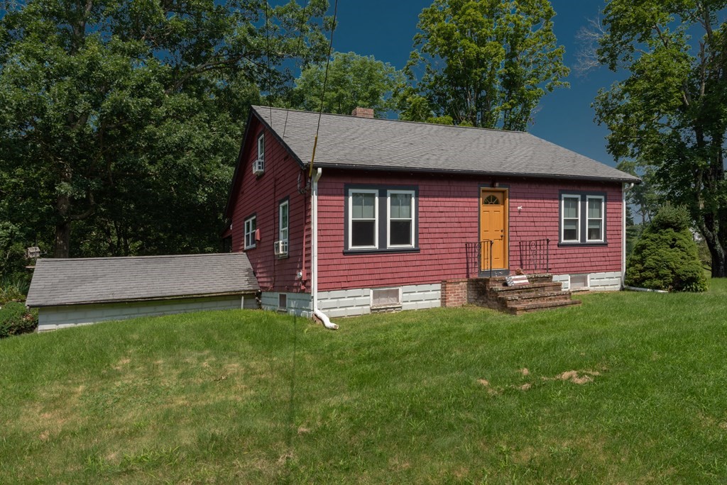 90 Anawan Street Rehoboth, MA 02769 - Photo 2 of 24 a front view of a house with a yard