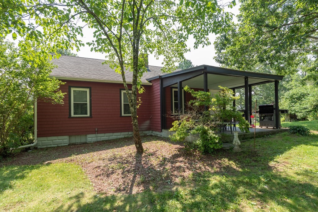 90 Anawan Street Rehoboth, MA 02769 - Photo 21 of 24 a front view of a house with garden