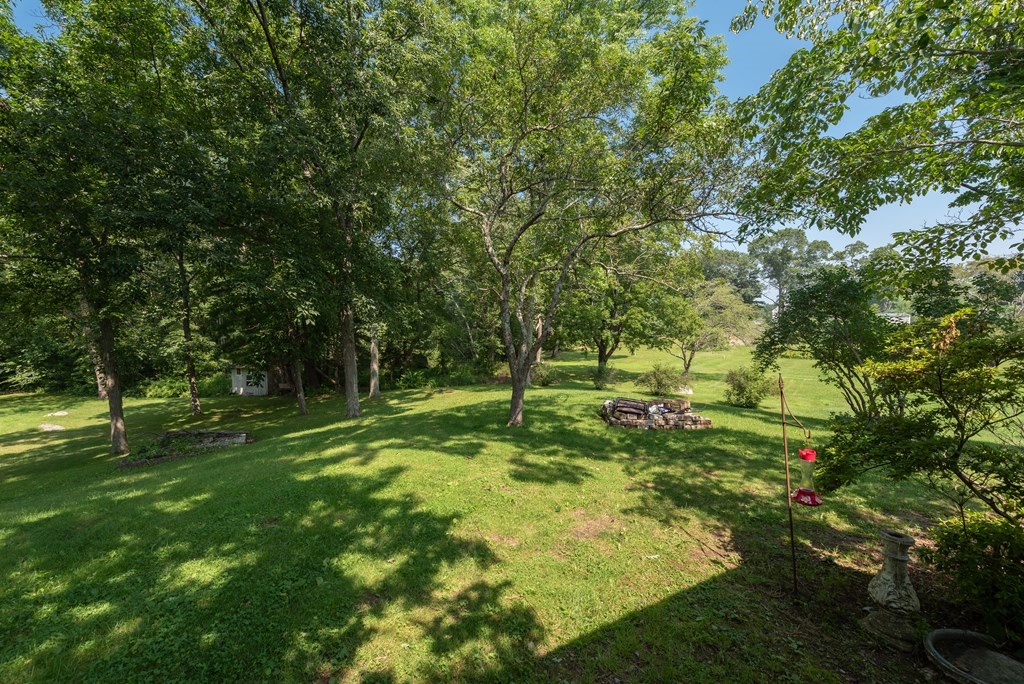 90 Anawan Street Rehoboth, MA 02769 - Photo 23 of 24 a backyard of a house with lots of green space