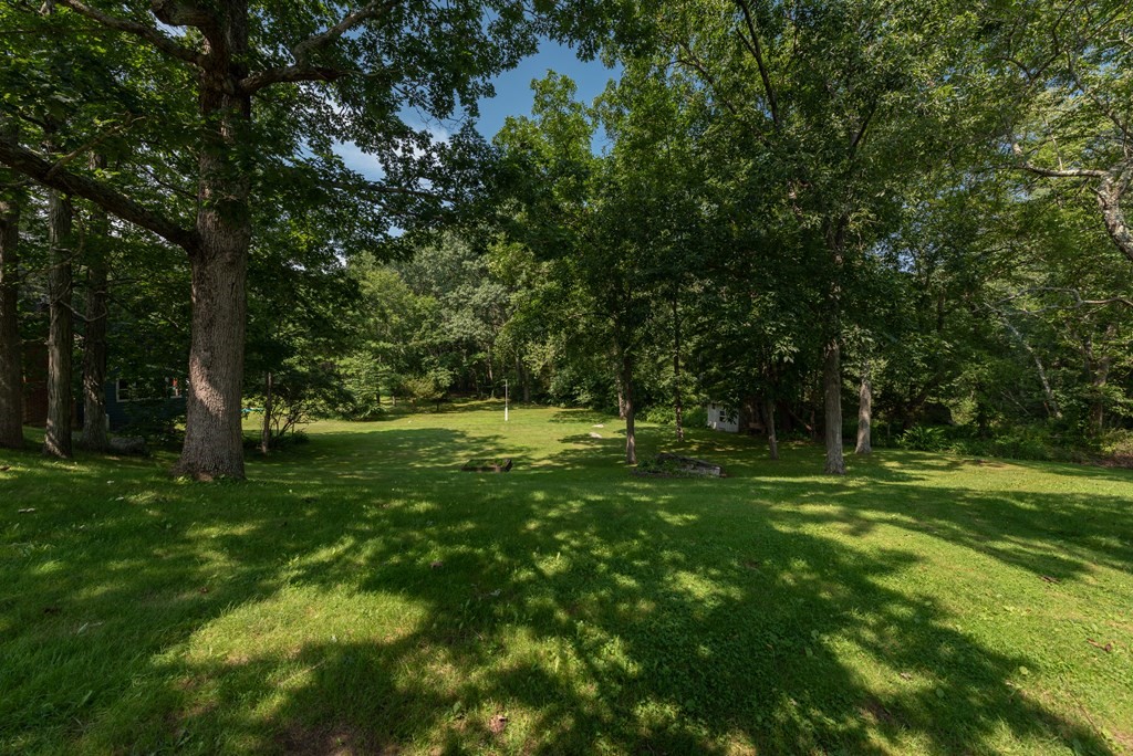 90 Anawan Street Rehoboth, MA 02769 - Photo 24 of 24 a view of outdoor space with trees all around