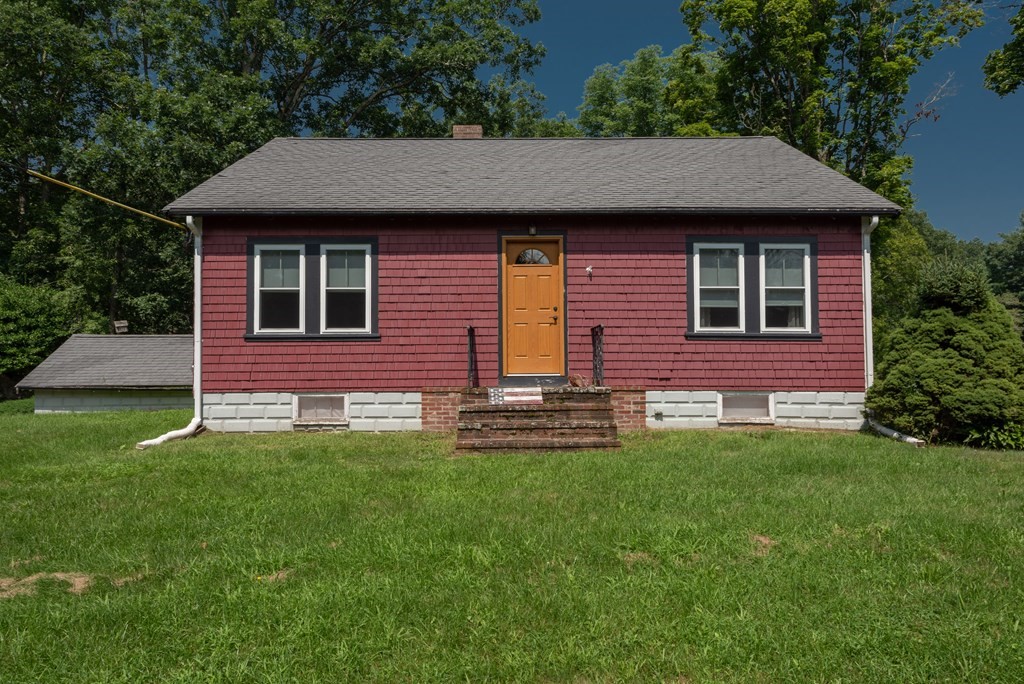 90 Anawan Street Rehoboth, MA 02769 - Photo 3 of 24 a front view of a house with a yard
