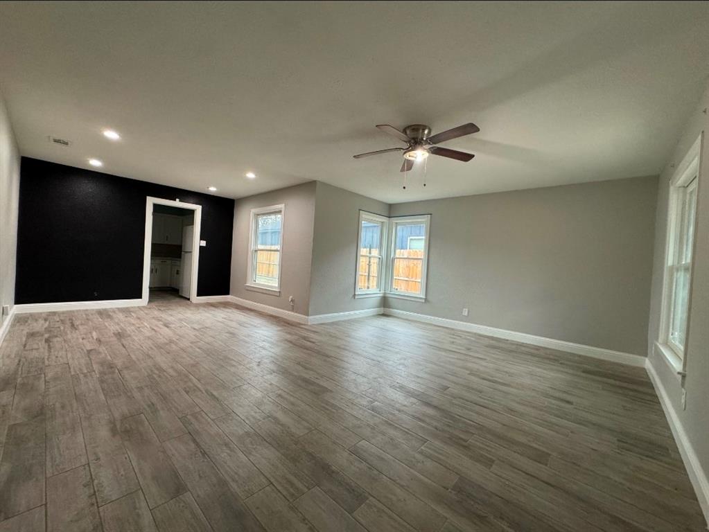 514 Woodrow Avenue Fort Worth, TX 76105 - Photo 2 of 13 a view of an empty room with a window