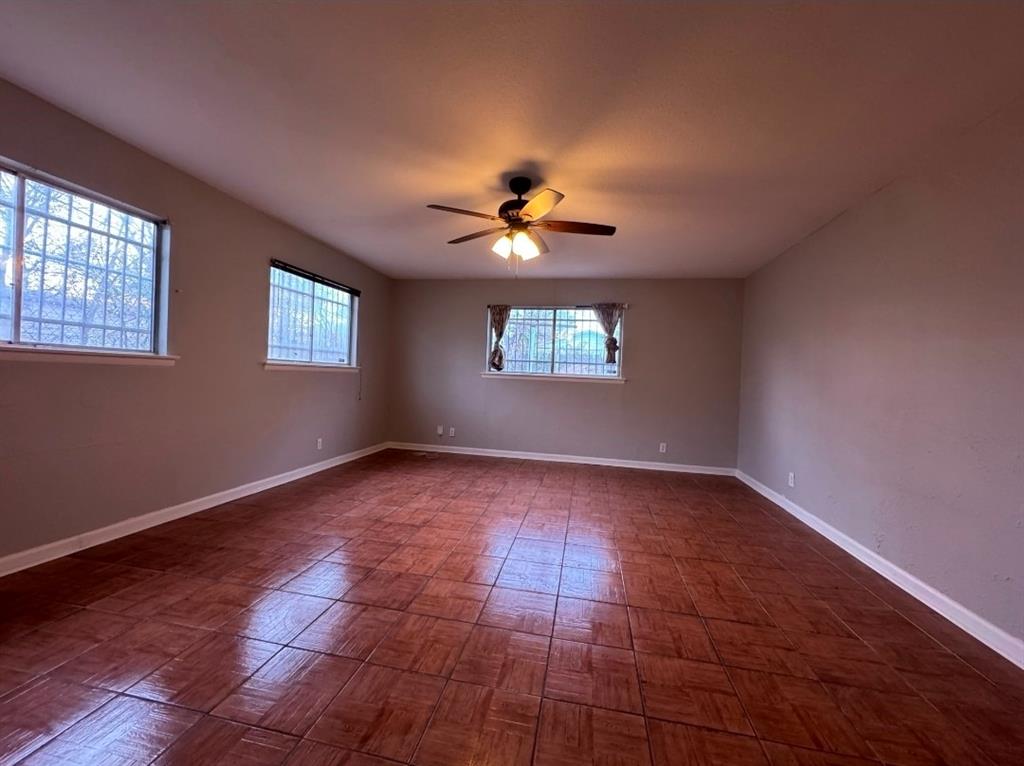 514 Woodrow Avenue Fort Worth, TX 76105 - Photo 8 of 13 a view of an empty room with a window
