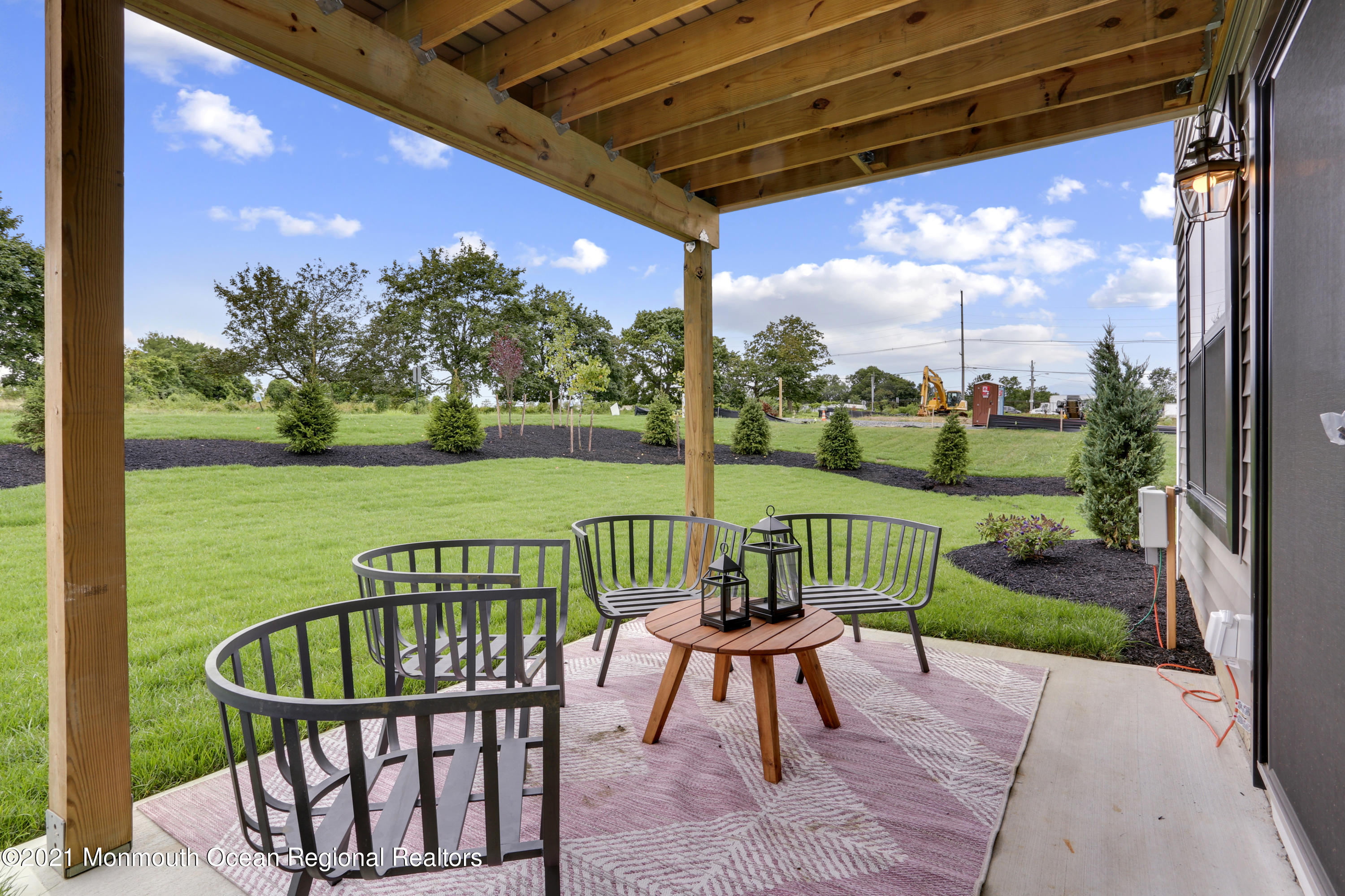 39 Mariveles Way Tinton Falls, NJ 07724 - Photo 11 of 16 a view of a chair and table in the patio