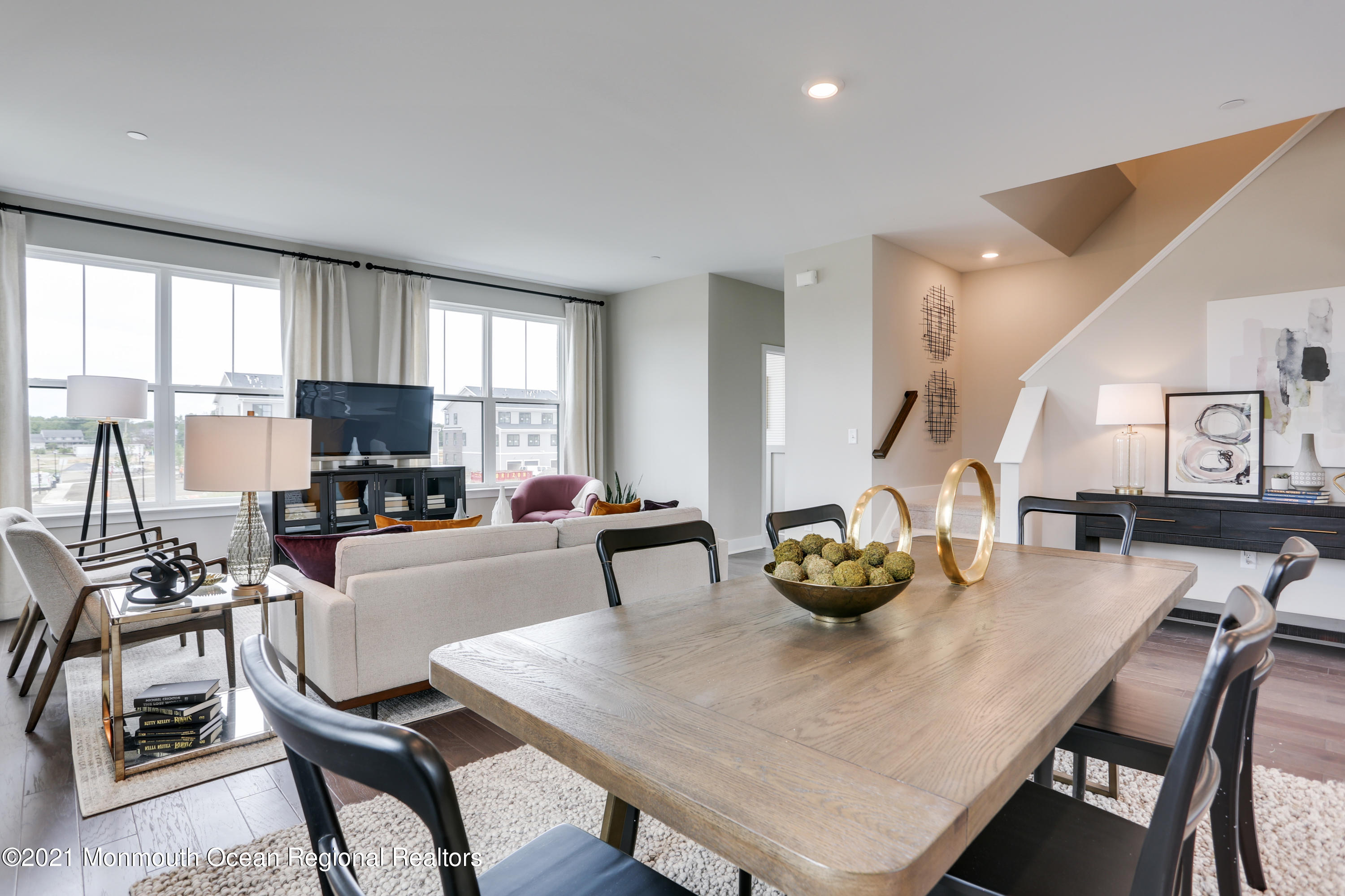 39 Mariveles Way Tinton Falls, NJ 07724 - Photo 12 of 16 a kitchen with a dining table chairs and white appliances