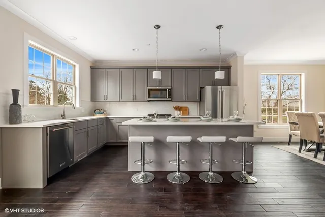 a kitchen with a sink cabinets and window