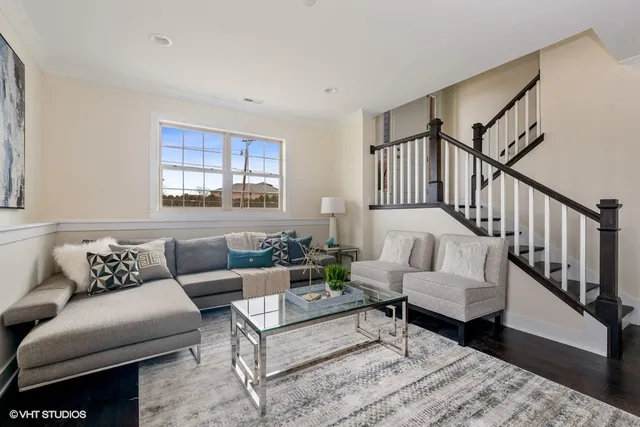 a living room with furniture and windows