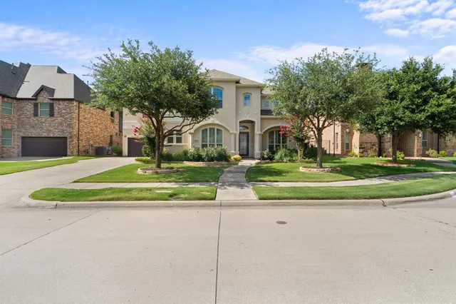 a view of house with outdoor space and trees