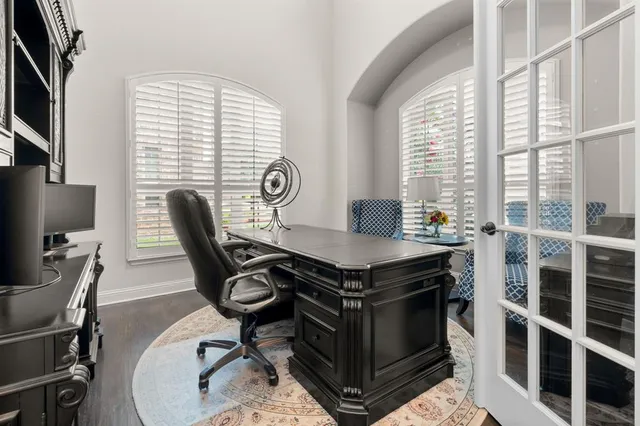 a view of a dining room with furniture and a window