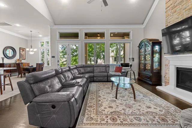 a living room with furniture fireplace and flat screen tv