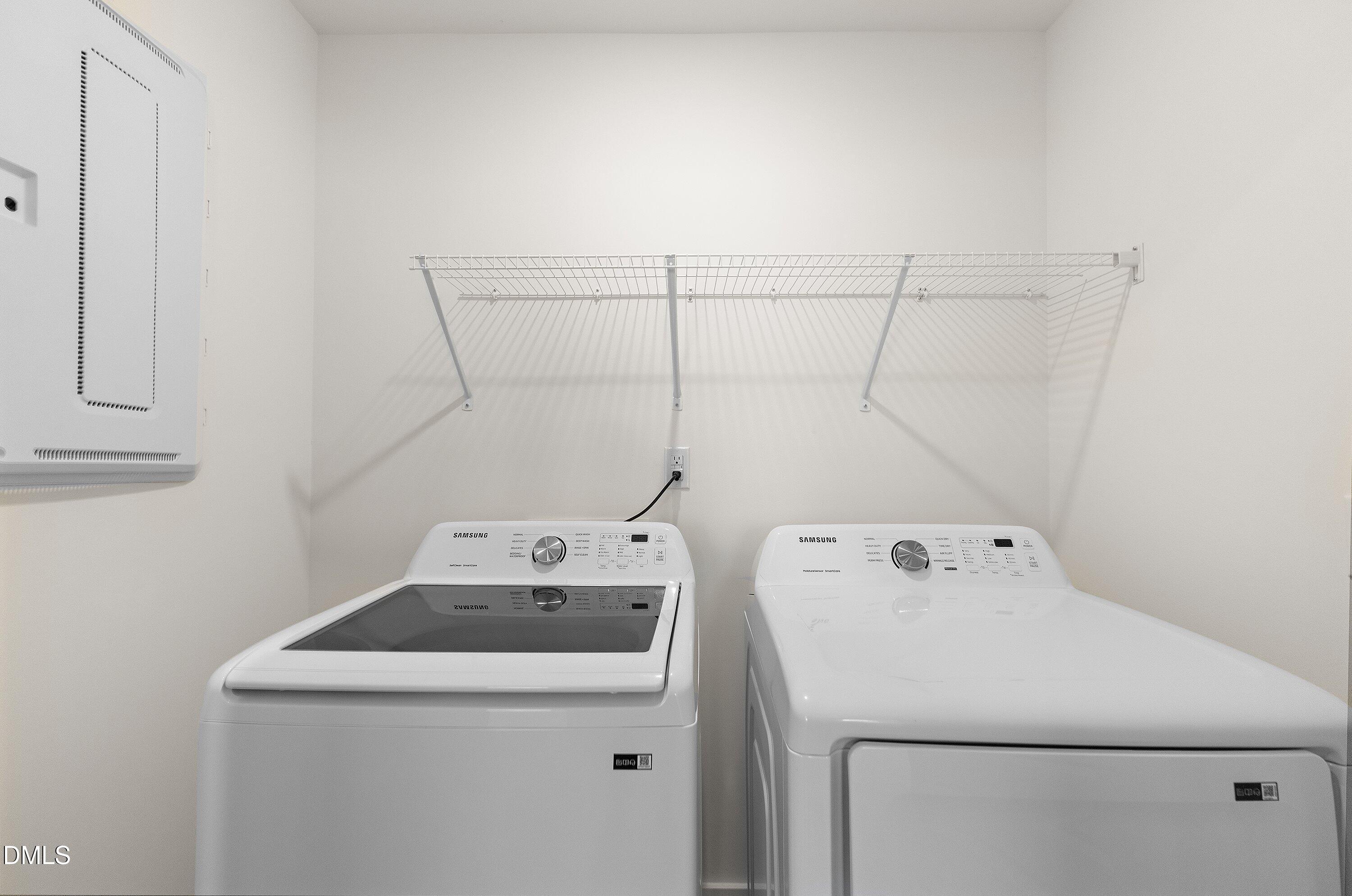 156 Sears Ridge Lane Morrisville, NC 27560 - Photo 29 of 49 a utility room with dryer and washer
